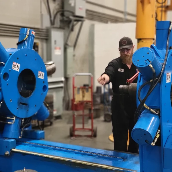 Blue equipment with a man worker in the back