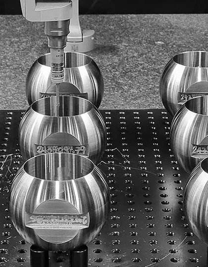 Machine hollowing out metal spheres